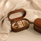 Corporate Gift Box—an elegant brown leather jewelry case for rings and earrings, displayed open on a beige fabric background. Ideal for curated jewelry collections or personalized corporate gifts.