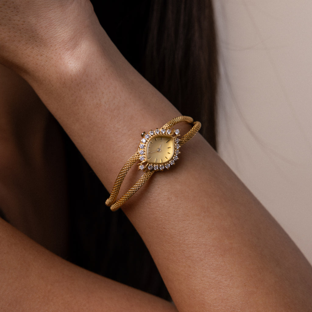Close up of a model's wrist wearing our Duo Chain Diamond Timepiece watch
