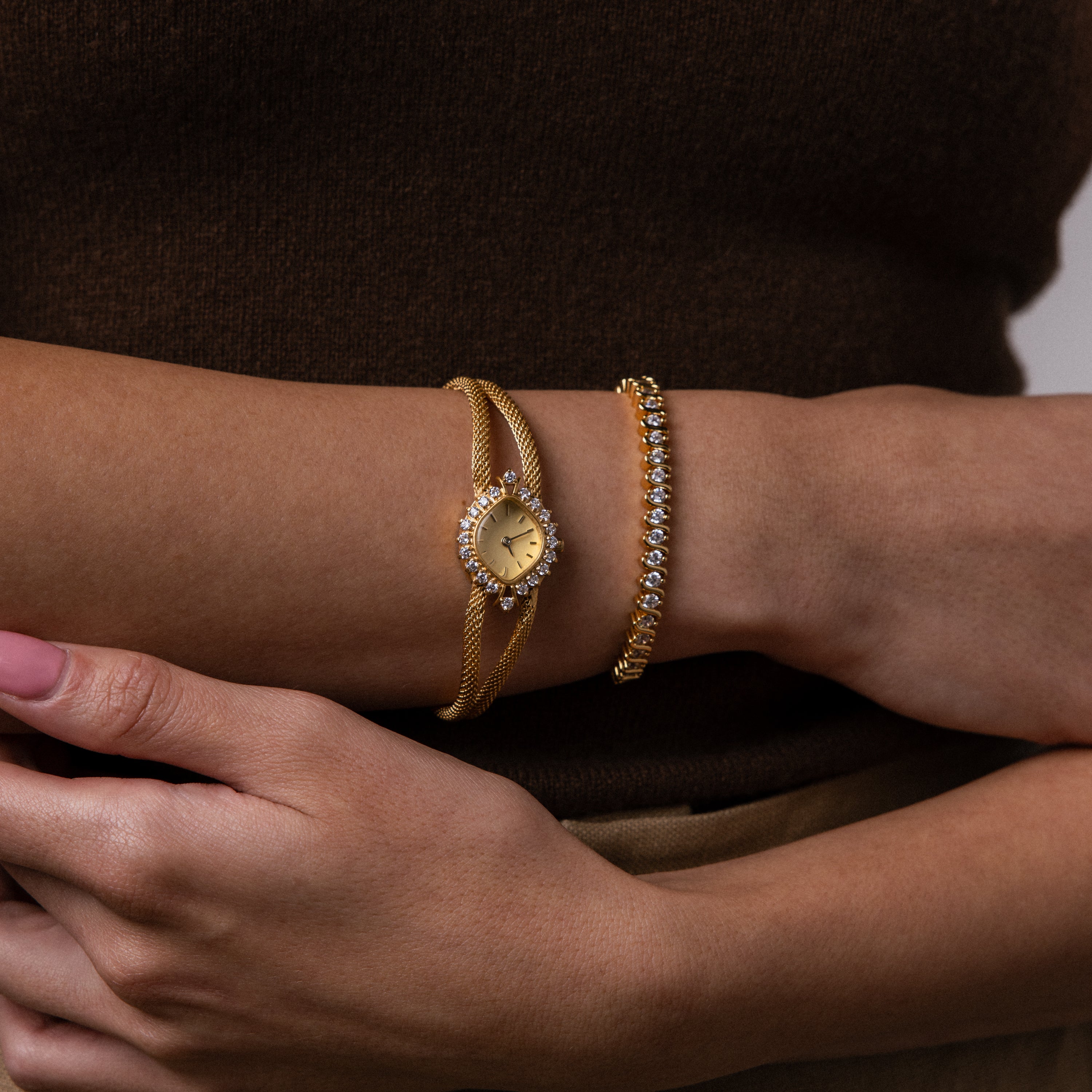 Close up of a model's wrist wearing our Duo Chain Diamond Timepiece watch, styled with our S-Link Diamond Tennis Bracelet