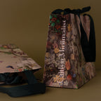 The Floral Gift Bag Add-On features floral patterns, black handles, and Cultivated Minimalist text, adding an elegant finishing touch to your gift wrapping.
