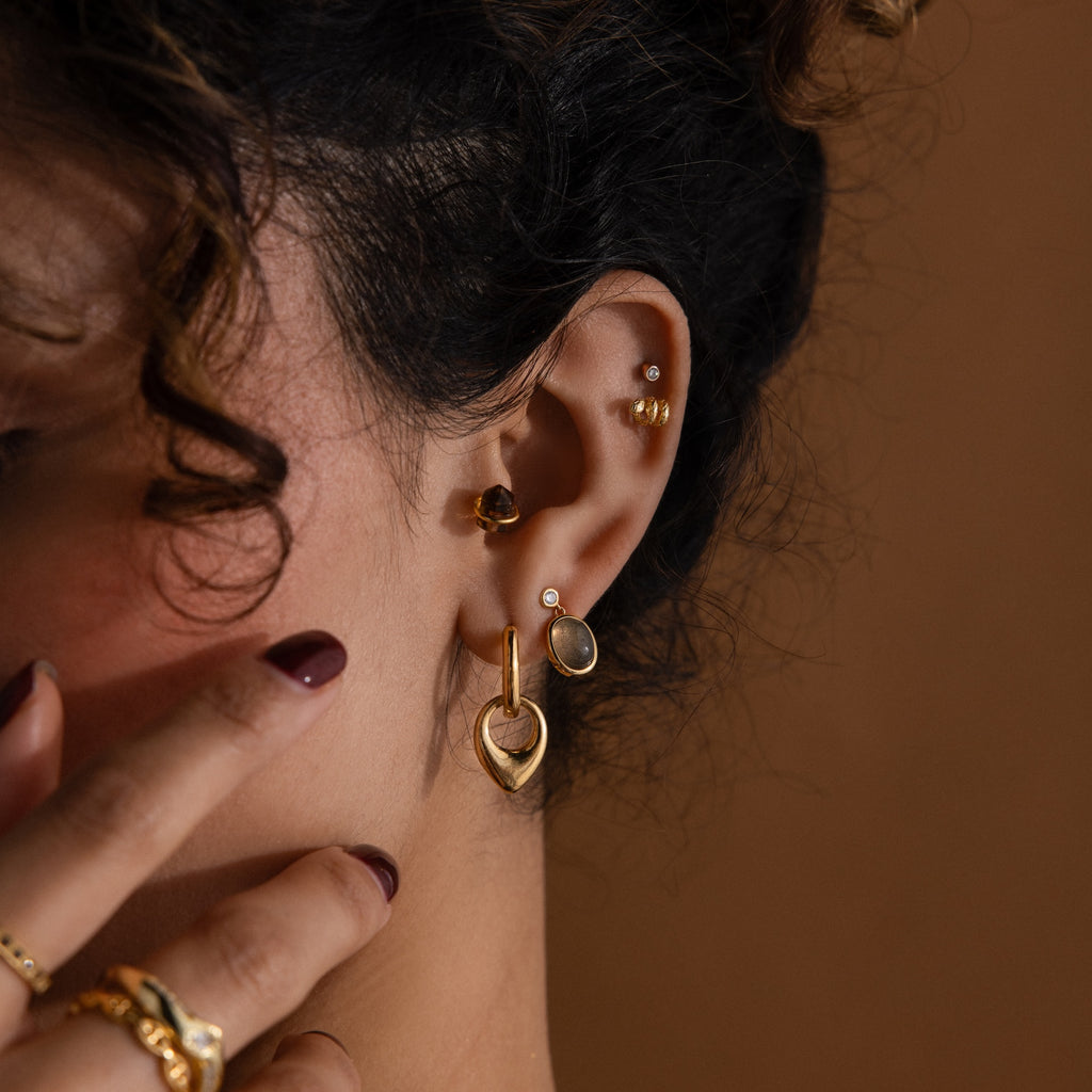 Clous d'oreilles serpent torsadés en or 18 carats