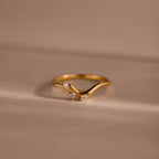 Gold curve marquise diamond ring with three sparkling marquise-cut diamonds in a chevron setting.