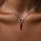 The Chili Pepper Charm in Sterling Silver necklace adds a vibrant, playful accent to the neck and collarbone, enhancing any jewelry collection with its unique design.