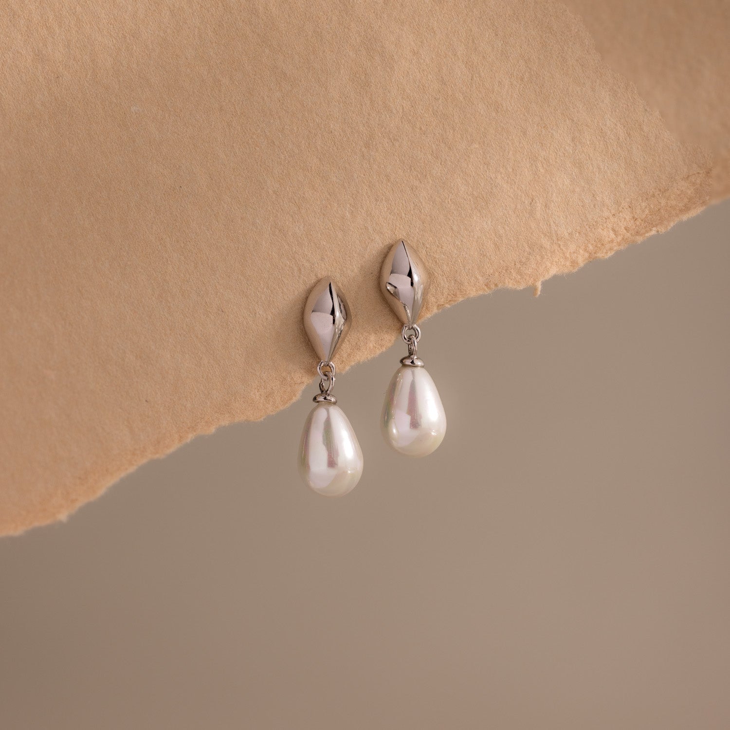 Tiny Pearl Drop Studs in Silver