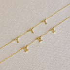 The Alice Spaced Number Necklace set features three delicate gold chains with small gold number pendants—one necklace with a "1" and two with a "2"—perfect for anyone who loves a minimalist, elegant look.