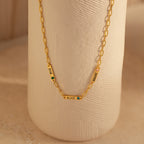 The Mini Name Birthstone Necklace features three gold nameplate charms—EMILY, ALICE, and JORDINE—with delicate flower designs. This personalized necklace makes a unique, thoughtful customized gift.