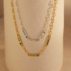 Two gold and one silver Mini Name Birthstone Necklaces featuring charms with names—RYAN, ALICE, REAGAN, ANDREA, BROOKE—are a perfect custom gift. Each paperclip chain adds a modern touch to this personalized accessory set.