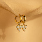 Opal Cluster Huggies with clusters of opal-like beads dangle elegantly—ideal as dainty hoop earrings or a thoughtful bridesmaid gift.