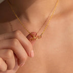 A person holds the Elegant Birthstone Name Necklace, featuring a custom pendant with "Mrs" written in delicate cursive.