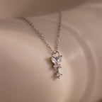 Close-up of the Diamond Butterfly Drop Jewelry Set in Sterling Silver, featuring a delicate diamond butterfly pendant resting gracefully on smooth, light-colored skin.