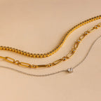 The Corporate Gift Box features three necklaces on a beige background: two gold chains and one silver chain with a small pendant—an elegant, curated choice perfect for personalized gifting.