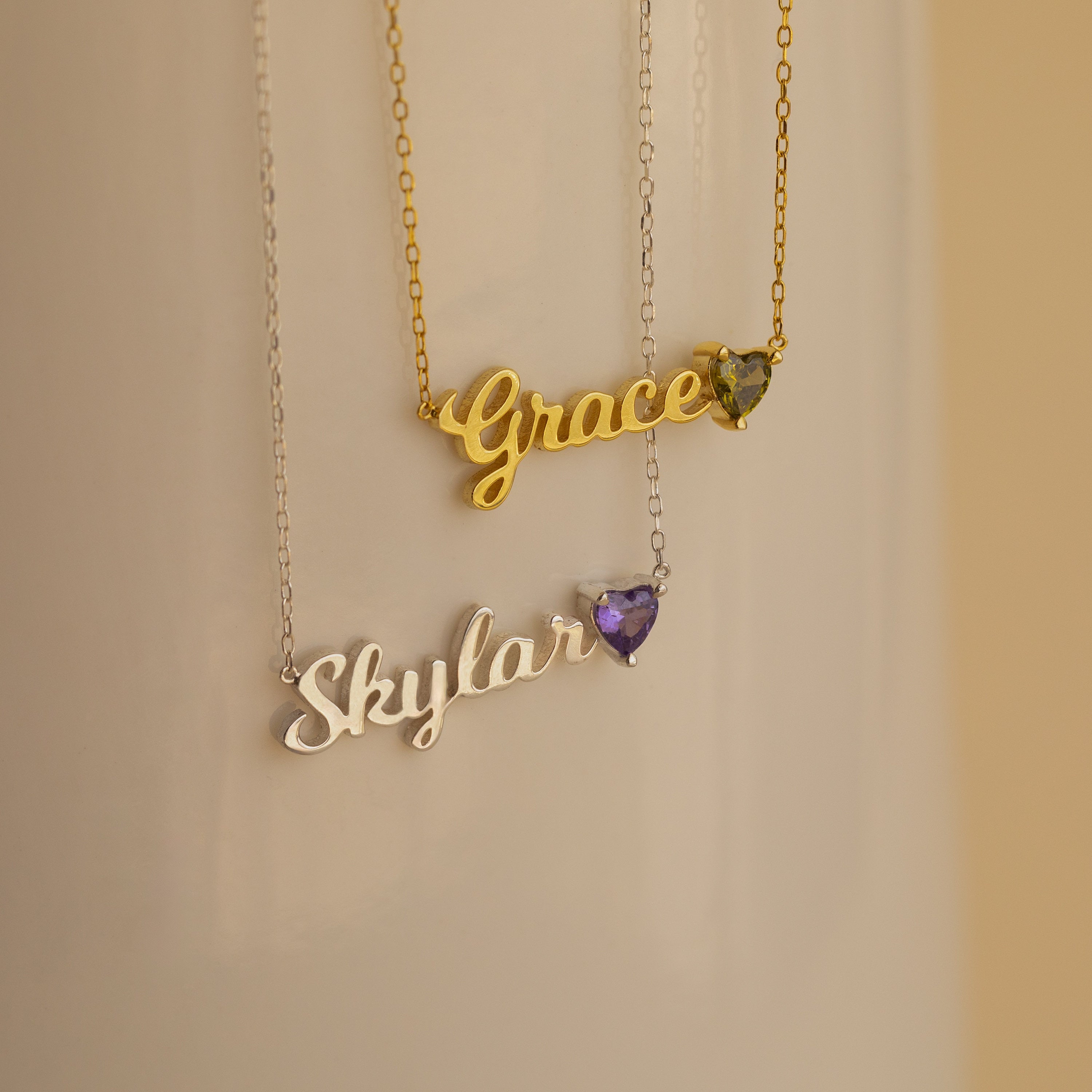 Discover the Mellow Name Heart Birthstone Necklace—a minimalist, personalized piece featuring your name and birthstone in an elegant heart design.