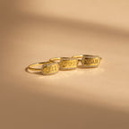 The Custom Pave Hexagon Ring rests on a beige surface—a perfect personalized minimalist ring with a modern geometric design.