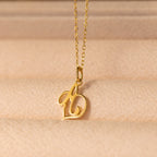 Initial Heart Necklace featuring a cursive letter b pendant on a soft beige textured surface—a beautiful custom piece and the perfect gift for someone you love.