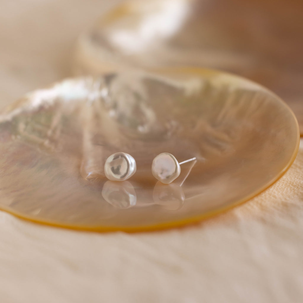 Freshwater Pearl Studs capture timeless elegance, each pair reflecting classic beauty in every detail.