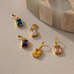 Multiple emerald birthstone charms in different stone colors including Amethyst, Blue Zircon, Diamond, Topaz and Pink Tourmaline