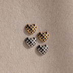 A set of heart-shaped buttons, inspired by the Checkered Heart Studs, brings retro charm to any project.
