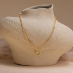 The Diamond Tennis Clasp Necklace is displayed on a textured, abstract bust against a neutral background—an elegant pick for wedding jewelry.
