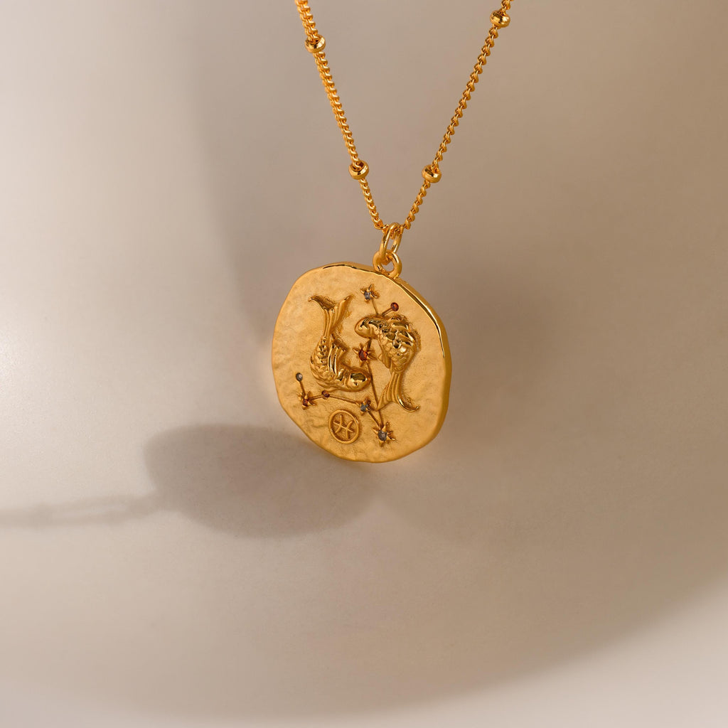Close up of a Pisces Zodiac Gemstone Coin Necklace
