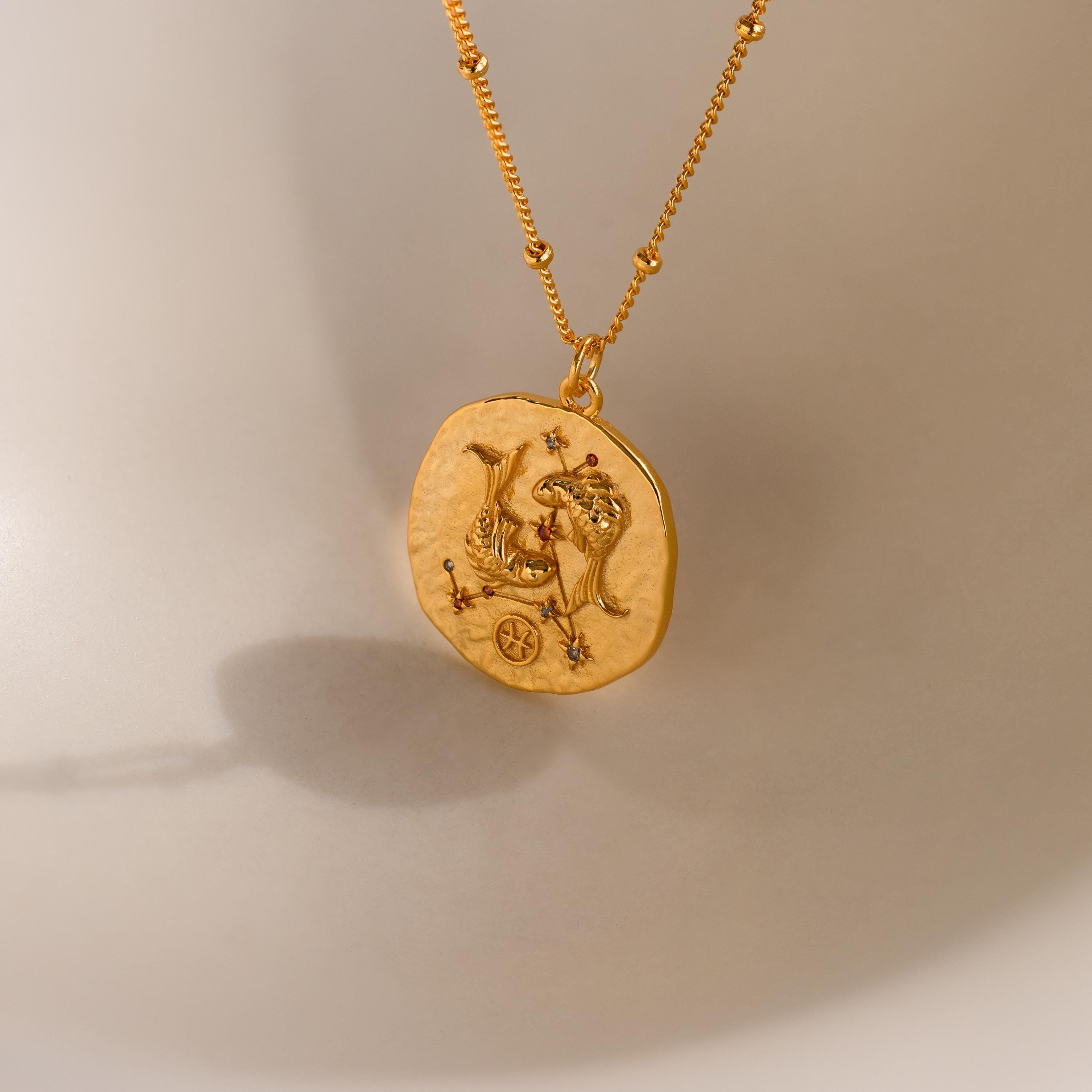 Close up of a Pisces Zodiac Gemstone Coin Necklace