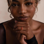 Model wearing a Red Marquise Ombre Ring with gradient marquise-cut stones in gold setting.