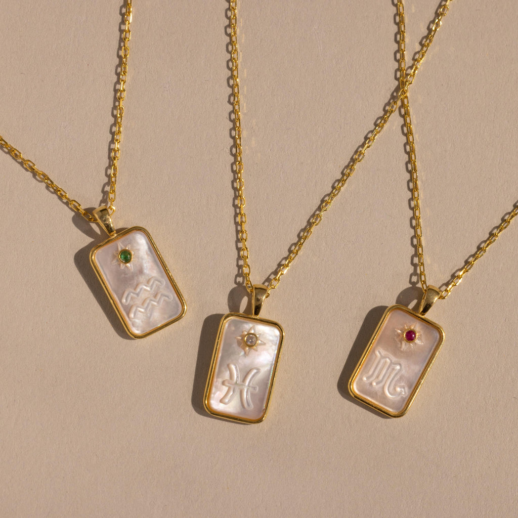 The Pearl Zodiac Birthstone Necklace in Sterling Silver features a chic zodiac pendant with a gemstone accent—perfect personalized jewelry for any necklace collection.
