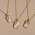 The Pearl Zodiac Birthstone Necklace in Sterling Silver features a chic zodiac pendant with a gemstone accent—perfect personalized jewelry for any necklace collection.