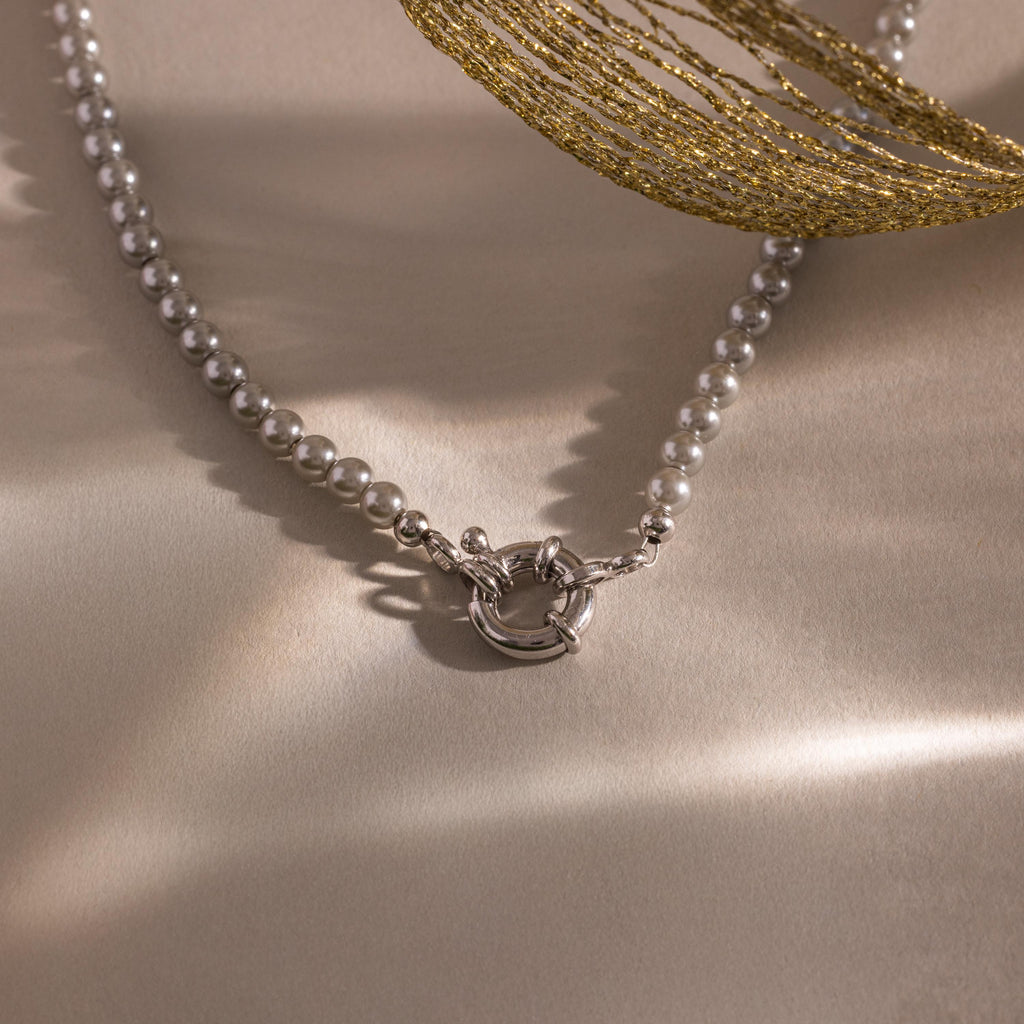 Flatlay of our Smoky Pearl Clasp Necklace
