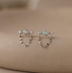 Flatlay of our Opal & Diamond Chain Studs