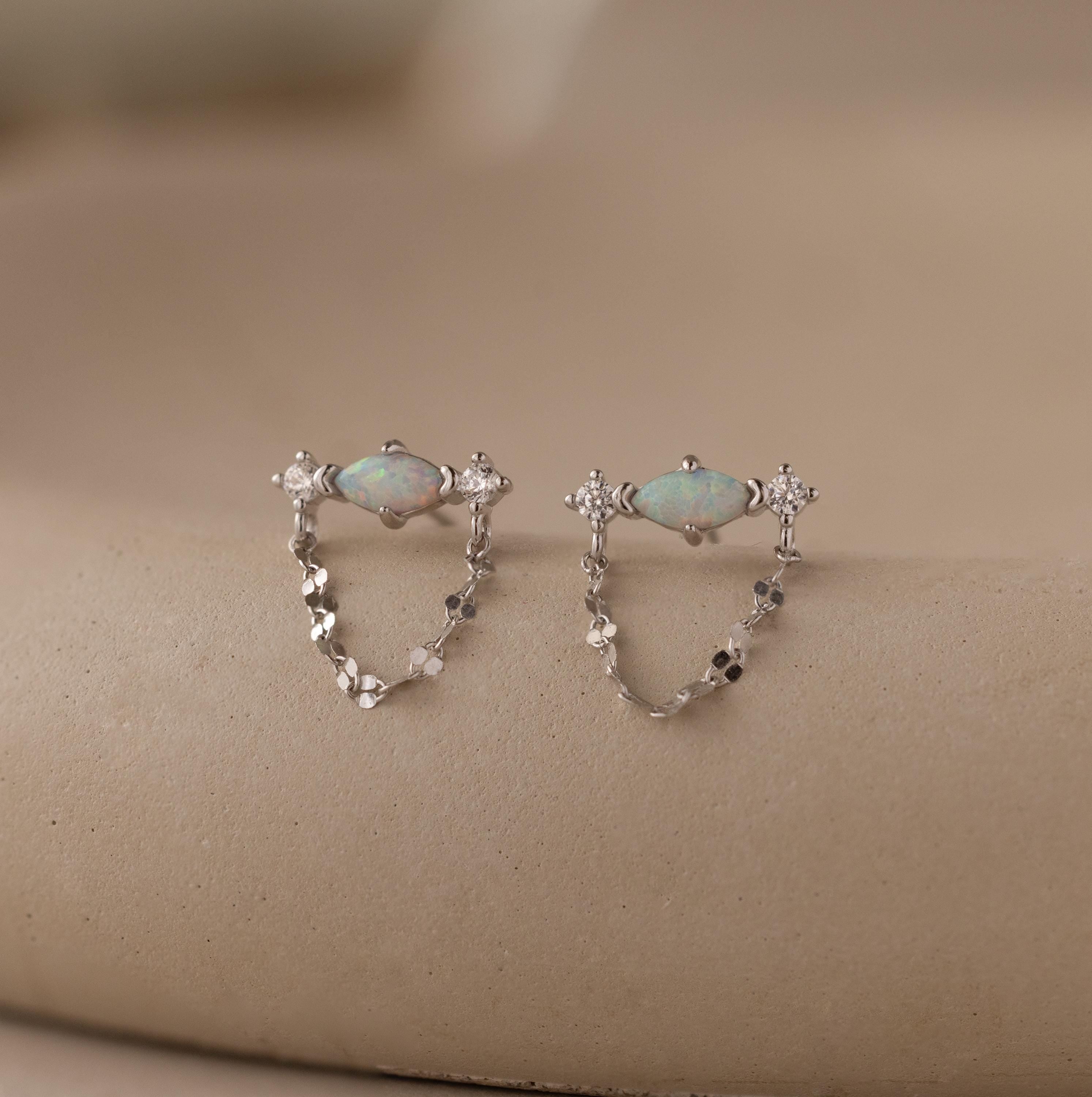 Flatlay of our Opal & Diamond Chain Studs