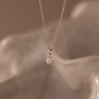Flatlay of our Opal Diamond Necklace in Sterling Silver