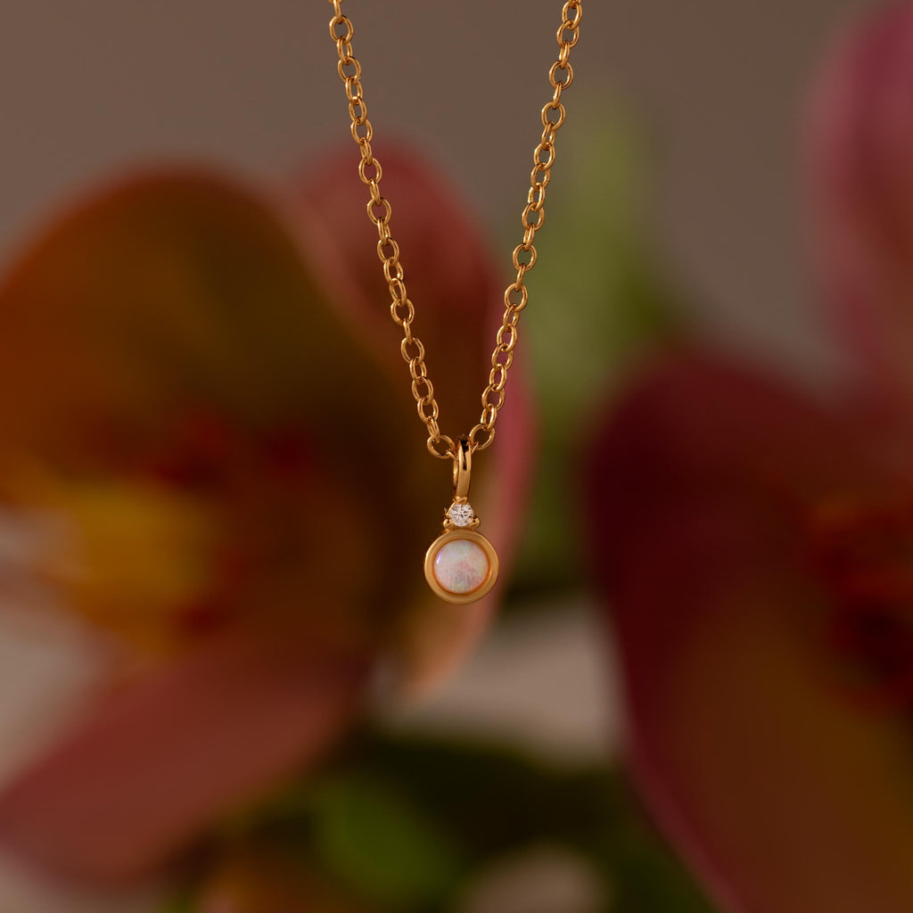 Close up image of our Opal Diamond Necklace in Gold