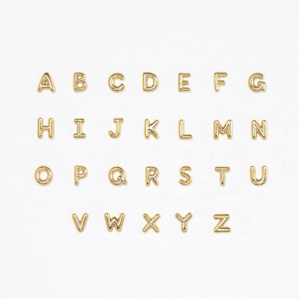 Flatlay showing all letters of our Bubble Initial Flatback Studs