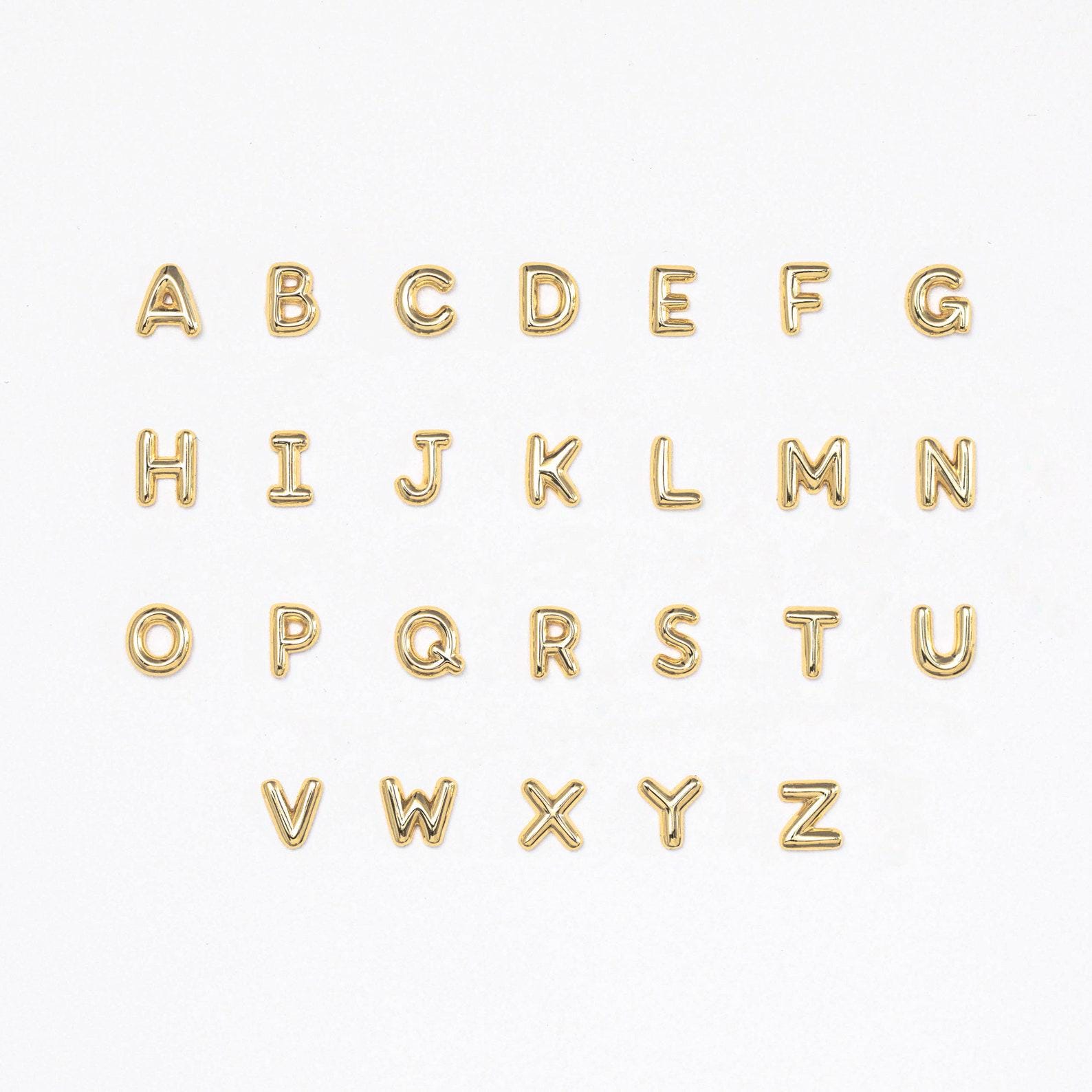 Flatlay showing all letters of our Bubble Initial Flatback Studs