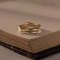 Flatlay of our Mixed Metal Wave Ring Set