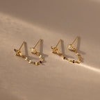 Flatlay of our Opal & Star Duo Chain Studs in Gold