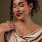 Model wearing our Holiday Diamond Tree Necklace, styled with our Holiday Diamond Tree Studs and our Marquise Birthstone Necklace
