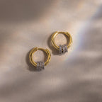 Close up flatlay image of our Mixed Metal Pave Hoops in 18K Gold
