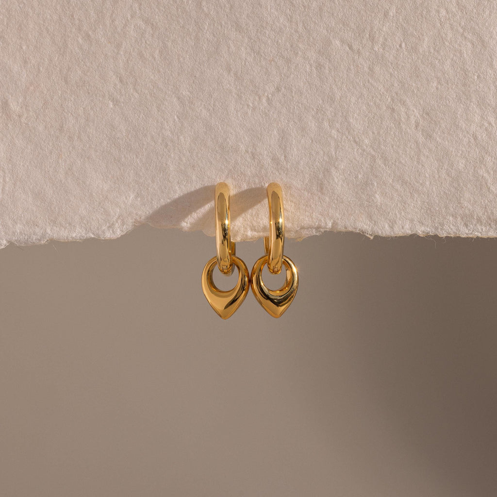 Close up flatlay of our Tiny Teardrop Huggies in Gold