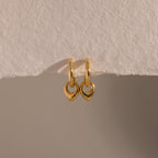 Close up flatlay of our Tiny Teardrop Huggies in Gold