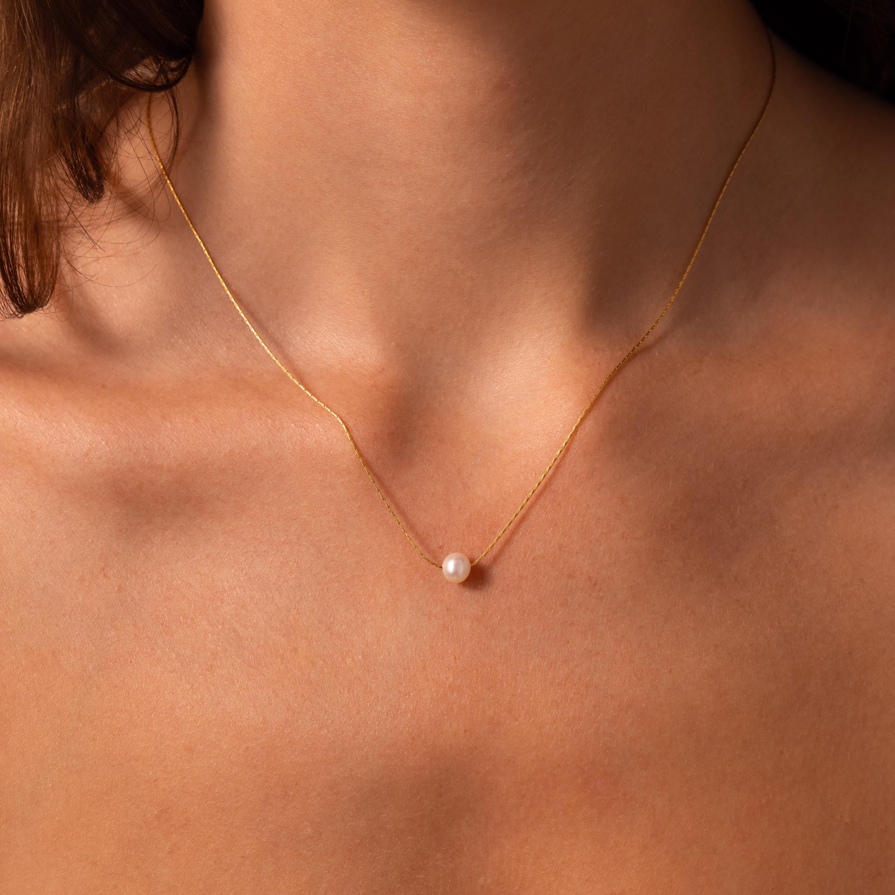 The Pearl Dot Necklace features a single pearl pendant for an elegant, dainty look—perfect for anyone who loves minimalist jewelry.
