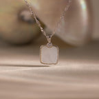 Square Mother of Pearl Necklace in Silver features an iridescent pendant with a diamond accent, beautifully displayed against a soft background—perfect for layering.
