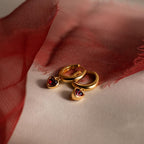 Dangling Garnet Heart Huggies in 18K Gold