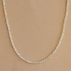 Opal Beaded Necklace showcased on a tan textured background, ideal for bringing bohemian charm to any outfit.