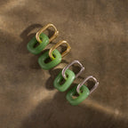 Jade Link Drop Hoops: two pairs of green jade and gold/silver chain link earrings on a brown surface.