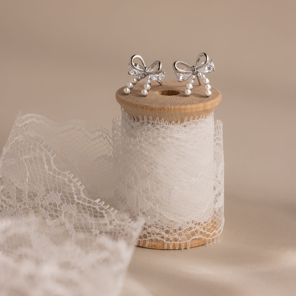 Pearl Diamond Bow Studs in Silver