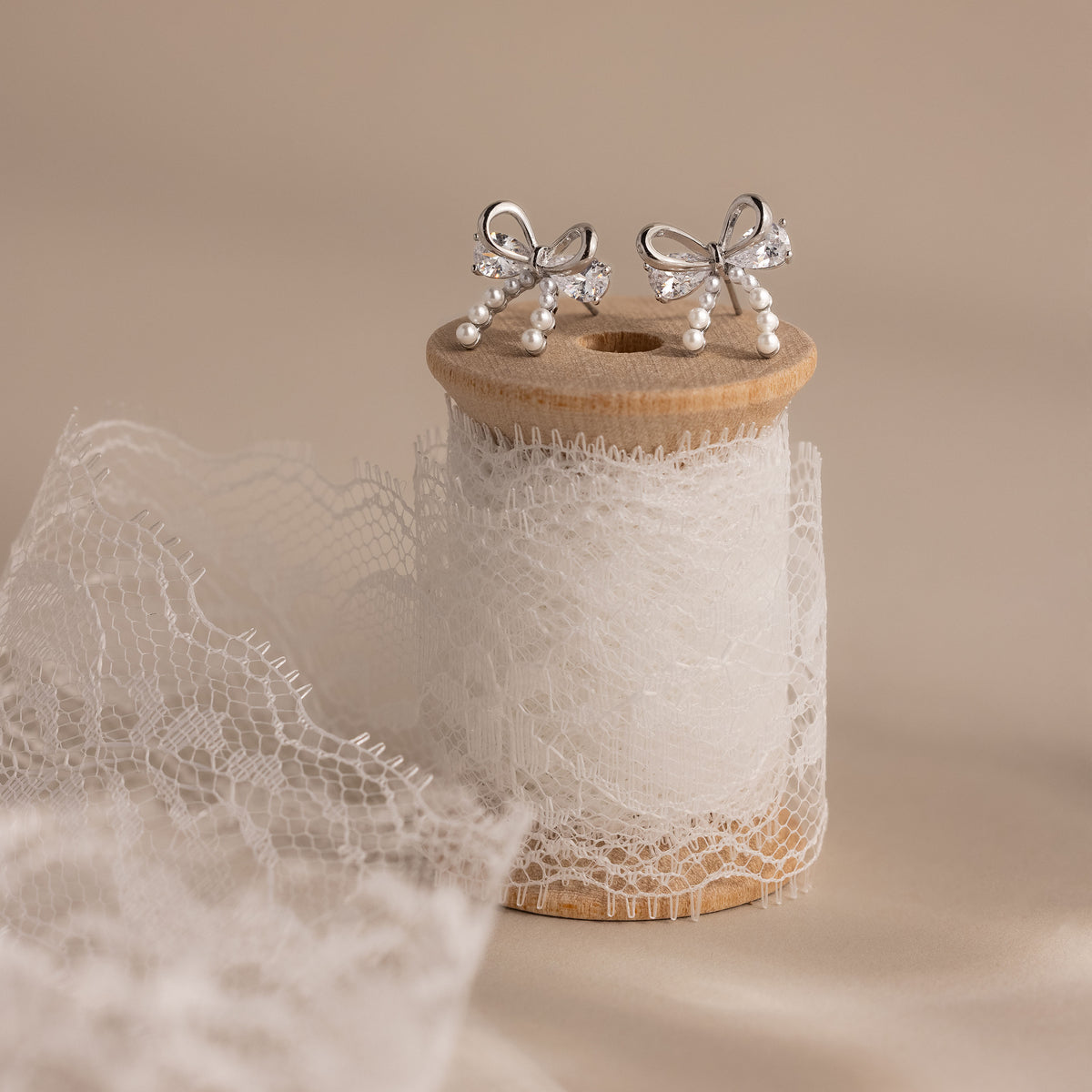 Pearl Diamond Bow Studs in Silver