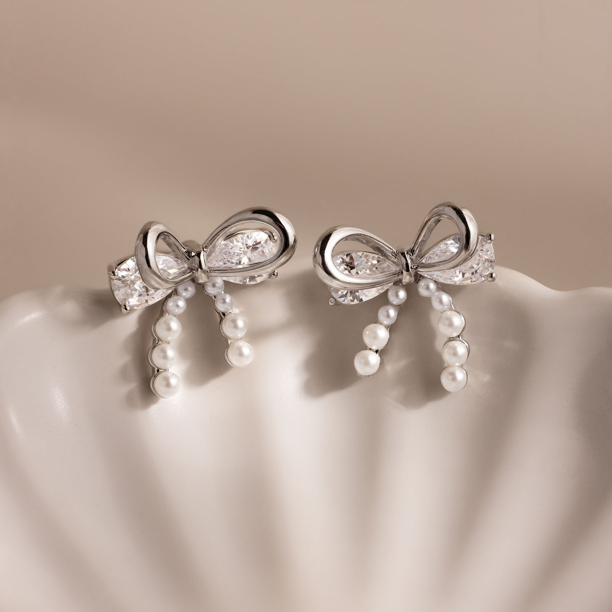 Pearl Diamond Bow Studs in Silver