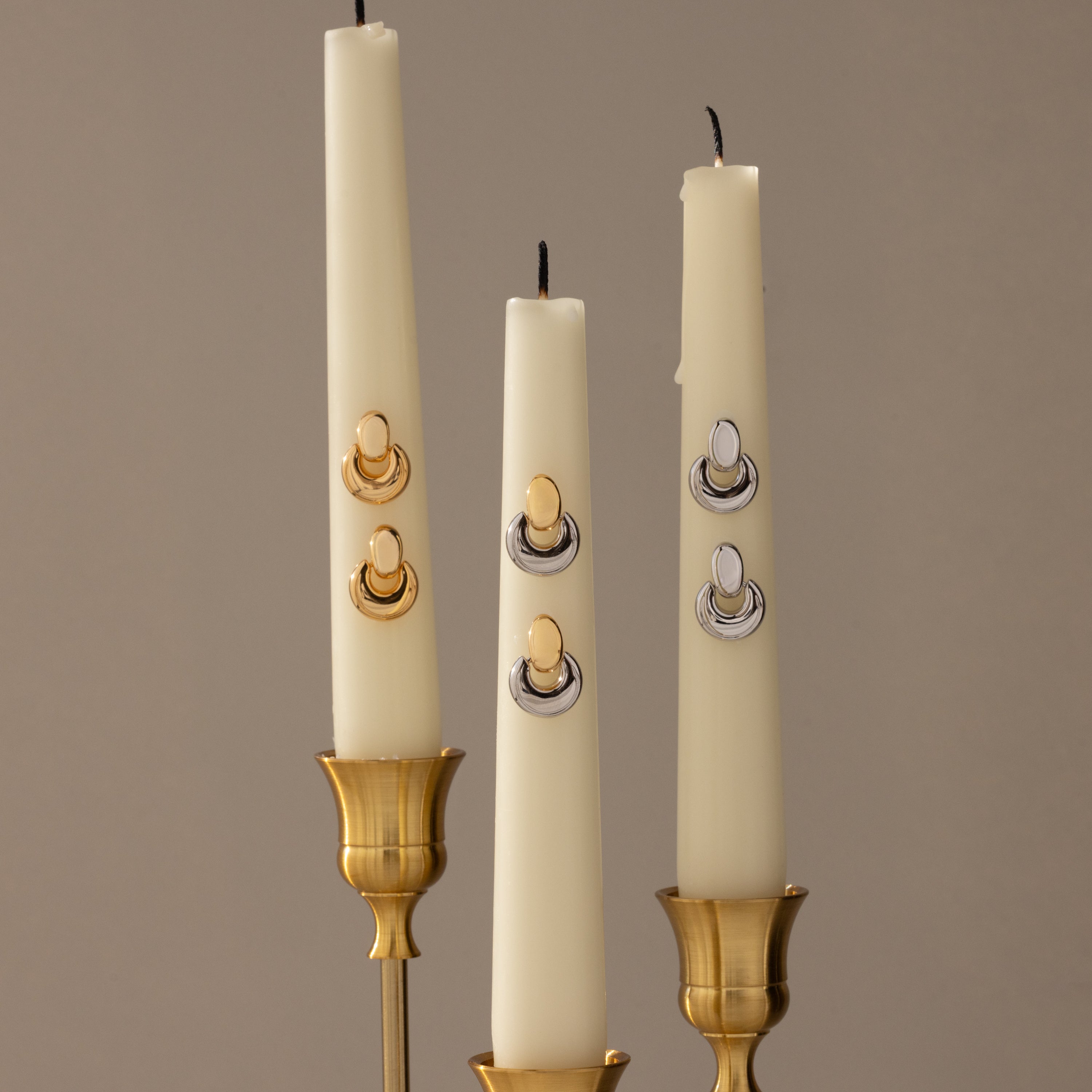 Eclipse Dome Studs, inspired by sculptural earrings, create a striking display that echoes the artistry of modern jewelry.