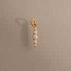 The Ombre Lace Opal Charm features four stacked opal beads on a gold pendant—the perfect personalized accessory or thoughtful birth month gift.